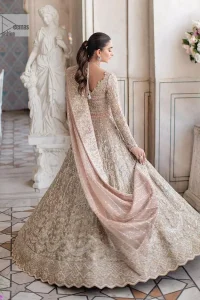 Carry the style that is your dream on your Nikah day with this classy article! A beautiful blouse in nude ivory colour is a perfect choice to pair with Lehenga. The blouse choli is emblazoned with silver embroidery and floral designs. Hand-crafted details of tilla, dabka, kora, Kundan and crystals make this choli a ravishing masterpiece. The boat shape neckline is a perfect choice to make this article super amazing. Further, the following blouse is maintain a balancing look of the bride with its full sleeves. It is handsomely systemized with a scalloped lehenga that is heavily adorned to win everyone's hearts at the very first glance with its charm and elegance. Finish this article with a dupatta its surface sprayed with sequin and beautifully framed by a heavily embellished floral border that is a perfect choice