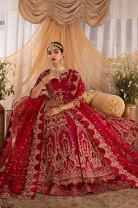 Enter the world of allurement with red shade, a gorgeous go-to dress for your big day to make you look classy and fabulous at the same time! A red organza base reception outfit is generously light golden embroidered with tilla, dabka, kora, Kundan and resham to form a beautifully composed lehenga, maxi and dupatta. The round neckline, three quarter sleeves make this outfit super amazing and charming. It is paired up with lehenga which is adorned with ting floral motifs. The can-can make this lehenga a dreamy real magic. Finish this look with dupatta, framed with a four sided borders. It is enhanced with sparkling of tiny floral motifs and sequins spray.