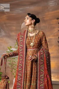 Blissful rust! This ensemble is the epitome of grace. DeemasFashion presents this beautiful mehndi outfit in rust colour to make your day super amazing. The flare maxi is attractively adorned with thread, kora, Kundan and the real magic of Zardozi. It is decorated with multiple colour embroidery to give you glam and gorgeous look. The round neckline and full sleeves are a finished way to make this masterpiece more attractive and charming. The following maxi is paired up with a dupatta in the same colour framed with a four-sided border to make the outfit graceful.