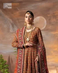 Blissful rust! This ensemble is the epitome of grace. DeemasFashion presents this beautiful mehndi outfit in rust colour to make your day super amazing. The flare maxi is attractively adorned with thread, kora, Kundan and the real magic of Zardozi. It is decorated with multiple colour embroidery to give you glam and gorgeous look. The round neckline and full sleeves are a finished way to make this masterpiece more attractive and charming. The following maxi is paired up with a dupatta in the same colour framed with a four-sided border to make the outfit graceful.
