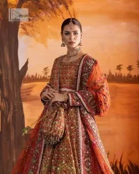 Blissful rust! This ensemble is the epitome of grace. DeemasFashion presents this beautiful mehndi outfit in rust colour to make your day super amazing. The flare maxi is attractively adorned with thread, kora, Kundan and the real magic of Zardozi. It is decorated with multiple colour embroidery to give you glam and gorgeous look. The round neckline and full sleeves are a finished way to make this masterpiece more attractive and charming. The following maxi is paired up with a dupatta in the same colour framed with a four-sided border to make the outfit graceful.