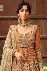 Let your dreams be your wings as your mehndi outfit. This rust heavy maxi features thoughtfully placed bold motifs all over and each motif is crafted using tilla, dabka, koran, Resham and Zardozi techniques. It is further enhanced with golden embroidery. The V shape neckline adds more beauty to the outfit when comes with embellished full sleeves. The beautiful outfit achieves the final ravishing look when paired with a delicate dupatta. The borders of this dupatta are heavily adorned with embroidery that gives a slaying touch to the whole attire.