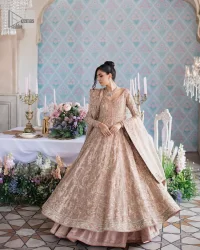 Make your Qabool Hai moment more memorable with this outfit by DeemasFashion. A dreamy statement of this dress proffers a soft pink hue with glamorous silver and golden embroidery.  It is further enhanced with tilla, dabka, kora, Kundan and the real magic of zardozi. V neckline enhances the overall glamour of this masterpiece. Intricate designs and fine details on the sleeves give a perfect finishing look to this maxi. The maxi is layered over a meticulously handcrafted lehnga which is bold enough to stand out in the crowd. Finish this article with a dupatta which is ornamented with four-sided borders and sequins sprayed all over which is a unique piece for your Nikah look.