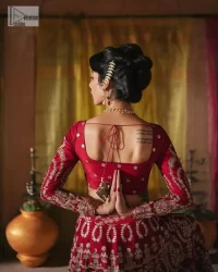 We are Introducing a wine red blouse and lehenga to our wide range of charming bridal dresses. The Pakistani reception Lehenga is an amalgamation of contemporary and traditional art which is decorated with golden embroidery. The embroidery is further enhanced with tilla, dabka, kora, Kundan and detailing of zardozi. It is paired up with a wine red blouse which is adorned with tiny floral motifs. The full sleeves of the blouse are heavily embellished to increase the beauty of the outfit. Further, the square neckline makes this blouse a unique masterpiece. Finish this with a dupatta with a four-sided embellished border and floral motifs all over.