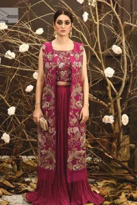 Sumptuously burgundy! This alluring outfit is surely any girl’s dream. DeemasFashion presents the three-piece outfit to make your event super bright. The blouse is handsomely laden with multiple colour embroidery. Beaming ornaments, zardozi, tilla,dabka, kora and Kundan make this blouse an epitome of grace. The boat shape neckline of the blouse a glamorous touch to this beautiful masterpiece. Paired up with a front open gown, hand-crafted beaming embellishments and luxury designs give a unique artistic look. The sleeveless style of the gown gives a royal appearance. Complete this article with a crushed skirt making it a perfect choice to pair with the blouse and gown.