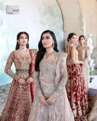 Keep it dreamy and classic with the best DeemasFashion reception wear! The handsome deep red outfit with blouse and lehenga is gracefully embellished with silver embroidery that gives you a head-turning appearance on the wedding day. The blouse is enhanced with tilla, dabka, kora, Kundan and crystals. The round neckline of the blouse makes this glamorous attire an epitome of royalty and grace. Luxury designs on half sleeves add super beauty to the outfit. It is organized with a lehenga adorned with embroidery to make your day charming. Finish this outfit with a dupatta embellished with four-sided borders and which is sprinkled with sequins all over.