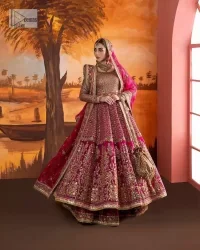 Experience the true essence of reception wear in alluring attires from DeemasFashion. The host pink pishwas is decorated with multiple colour embroidery which is handsomely enhanced with tilla, dabka, kora, Kundan and the real magic of Zardozi to make this masterpiece unique and charming. The finishing of boat shape neckline enhances the beauty of the attire. Furthermore, the full sleeves of the pishwas are a perfectly charming choice to pair with a Pishwas. It is coordinated with a jamawar lehenga whose border is adorned with beautiful embroidery. Complete this article with a dupatta framed with four-sided embellished borders and sequins sprayed all over.