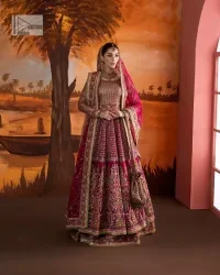 Experience the true essence of reception wear in alluring attires from DeemasFashion. The host pink pishwas is decorated with multiple colour embroidery which is handsomely enhanced with tilla, dabka, kora, Kundan and the real magic of Zardozi to make this masterpiece unique and charming. The finishing of boat shape neckline enhances the beauty of the attire. Furthermore, the full sleeves of the pishwas are a perfectly charming choice to pair with a Pishwas. It is coordinated with a jamawar lehenga whose border is adorned with beautiful embroidery. Complete this article with a dupatta framed with four-sided embellished borders and sequins sprayed all over.
