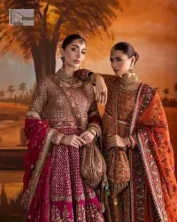 Experience the true essence of reception wear in alluring attires from DeemasFashion. The host pink pishwas is decorated with multiple colour embroidery which is handsomely enhanced with tilla, dabka, kora, Kundan and the real magic of Zardozi to make this masterpiece unique and charming. The finishing of boat shape neckline enhances the beauty of the attire. Furthermore, the full sleeves of the pishwas are a perfectly charming choice to pair with a Pishwas. It is coordinated with a jamawar lehenga whose border is adorned with beautiful embroidery. Complete this article with a dupatta framed with four-sided embellished borders and sequins sprayed all over.
