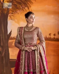 Experience the true essence of reception wear in alluring attires from DeemasFashion. The host pink pishwas is decorated with multiple colour embroidery which is handsomely enhanced with tilla, dabka, kora, Kundan and the real magic of Zardozi to make this masterpiece unique and charming. The finishing of boat shape neckline enhances the beauty of the attire. Furthermore, the full sleeves of the pishwas are a perfectly charming choice to pair with a Pishwas. It is coordinated with a jamawar lehenga whose border is adorned with beautiful embroidery. Complete this article with a dupatta framed with four-sided embellished borders and sequins sprayed all over.
