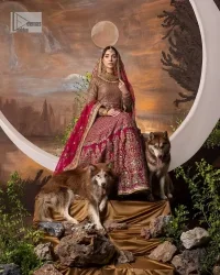 Experience the true essence of reception wear in alluring attires from DeemasFashion. The host pink pishwas is decorated with multiple colour embroidery which is handsomely enhanced with tilla, dabka, kora, Kundan and the real magic of Zardozi to make this masterpiece unique and charming. The finishing of boat shape neckline enhances the beauty of the attire. Furthermore, the full sleeves of the pishwas are a perfectly charming choice to pair with a Pishwas. It is coordinated with a jamawar lehenga whose border is adorned with beautiful embroidery. Complete this article with a dupatta framed with four-sided embellished borders and sequins sprayed all over.