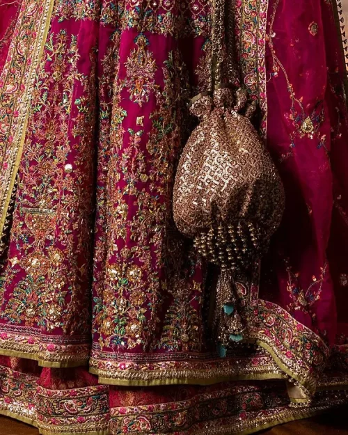 Experience the true essence of reception wear in alluring attires from DeemasFashion. The host pink pishwas is decorated with multiple