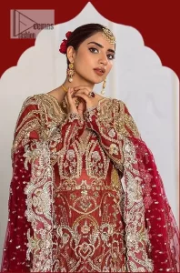 It’s all about looking stunning with a gorgeous Pakistani reception wear Red outfit. This beautiful red dress is designed with trendy full sleeves, following a back train maxi styled exquisitely with a floral pattern on sleeves. A sweeheart neckline makes your beauty bones prominent with a marvelous touch of light golden embroidery. It is paired up with light gold frilled lehenga which is enhance with tilla, dbka, kora, Kundan that is surely going to get you a lot of praise on your Big day. Giving it a final touch with dupatta, framed with a four sided borders and sequins sprayed all over to serve you with extraordinary grace.