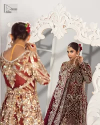 It’s all about looking stunning with a gorgeous Pakistani reception wear Red outfit. This beautiful red dress is designed with trendy full sleeves, following a back train maxi styled exquisitely with a floral pattern on sleeves. A sweeheart neckline makes your beauty bones prominent with a marvelous touch of light golden embroidery. It is paired up with light gold frilled lehenga which is enhance with tilla, dbka, kora, Kundan that is surely going to get you a lot of praise on your Big day. Giving it a final touch with dupatta, framed with a four sided borders and sequins sprayed all over to serve you with extraordinary grace.