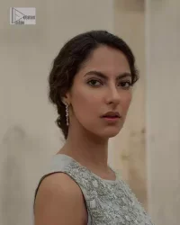 Balancing outfit lovers here’s your style treat! The handsome and charming steel grey attire is an epitome of elegance and royalty that gives you a head-turning appearance on the party occasion. The front open gown is laden with silver embroidery that is further enhanced with tilla, dabka, kora, Kundan and luxuries of crystals. The round neckline of this gown is emblazoned with luxury designs and embroidery. In addition to this, the sleeveless style makes this article a masterpiece. Paired up with straight trousers to balance the look of this exquisite article.