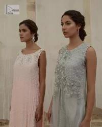 Balancing outfit lovers here’s your style treat! The handsome and charming steel grey attire is an epitome of elegance and royalty that gives you a head-turning appearance on the party occasion. The front open gown is laden with silver embroidery that is further enhanced with tilla, dabka, kora, Kundan and luxuries of crystals. The round neckline of this gown is emblazoned with luxury designs and embroidery. In addition to this, the sleeveless style makes this article a masterpiece. Paired up with straight trousers to balance the look of this exquisite article.