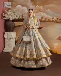 Enhance your beauty by dressing in magic. The most beautiful day of your life deserves an overall dome of embodiment, which is why you need an aqua-blue Anarkali to make you look stunning as a bride. The aqua blue, Anarkali and lehenga are hand-rendered in multiple colour embroidery and are further enhanced with pearls, nakshi, Sitara, tilla, kora, Zardozi and dabka.  The round neckline of the following Anarkali defines the beauty and charm of this unique article. Furthermore, the full sleeves are adorned with floral patterns. It is paired up with lehenga which is ornamented with a heavily embellished border to make this masterpiece unique. Complete this nikah wear with a dupatta adorned with four-sided embellished borders and tiny motifs sprinkled all over.