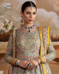 Enhance your beauty by dressing in magic. The most beautiful day of your life deserves an overall dome of embodiment, which is why you need an aqua-blue Anarkali to make you look stunning as a bride. The aqua blue, Anarkali and lehenga are hand-rendered in multiple colour embroidery and are further enhanced with pearls, nakshi, Sitara, tilla, kora, Zardozi and dabka.  The round neckline of the following Anarkali defines the beauty and charm of this unique article. Furthermore, the full sleeves are adorned with floral patterns. It is paired up with lehenga which is ornamented with a heavily embellished border to make this masterpiece unique. Complete this nikah wear with a dupatta adorned with four-sided embellished borders and tiny motifs sprinkled all over.