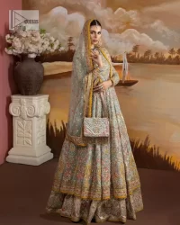 Enhance your beauty by dressing in magic. The most beautiful day of your life deserves an overall dome of embodiment, which is why you need an aqua-blue Anarkali to make you look stunning as a bride. The aqua blue, Anarkali and lehenga are hand-rendered in multiple colour embroidery and are further enhanced with pearls, nakshi, Sitara, tilla, kora, Zardozi and dabka.  The round neckline of the following Anarkali defines the beauty and charm of this unique article. Furthermore, the full sleeves are adorned with floral patterns. It is paired up with lehenga which is ornamented with a heavily embellished border to make this masterpiece unique. Complete this nikah wear with a dupatta adorned with four-sided embellished borders and tiny motifs sprinkled all over.