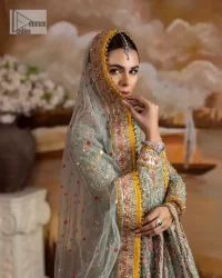 Enhance your beauty by dressing in magic. The most beautiful day of your life deserves an overall dome of embodiment, which is why you need an aqua-blue Anarkali to make you look stunning as a bride. The aqua blue, Anarkali and lehenga are hand-rendered in multiple colour embroidery and are further enhanced with pearls, nakshi, Sitara, tilla, kora, Zardozi and dabka.  The round neckline of the following Anarkali defines the beauty and charm of this unique article. Furthermore, the full sleeves are adorned with floral patterns. It is paired up with lehenga which is ornamented with a heavily embellished border to make this masterpiece unique. Complete this nikah wear with a dupatta adorned with four-sided embellished borders and tiny motifs sprinkled all over.