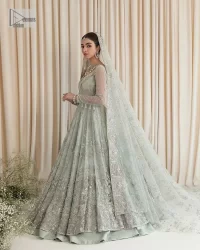 Exquisitely designed ensembles with delicate embroideries & traditional embellishments for nikah outfit statements. This beautiful maxi that comes in aqua blue colour is beautifully embellished with crystals and zardozi work. Beads, motifs,tilla, dabka, sequins, and shimmering adornments enhance the overall charm of this alluring maxi. Perfect stitching and intricate details give a royal appearance to the Bride. The bodice has a delicate and feminine V shape neckline with embellished full sleeves. Paired with lehnga and an alluring dupatta with a heavy spray of sparkling sequins and a detailed head embellished border to make your day super charming.