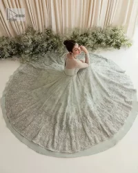 Exquisitely designed ensembles with delicate embroideries & traditional embellishments for nikah outfit statements. This beautiful maxi that comes in aqua blue colour is beautifully embellished with crystals and zardozi work. Beads, motifs,tilla, dabka, sequins, and shimmering adornments enhance the overall charm of this alluring maxi. Perfect stitching and intricate details give a royal appearance to the Bride. The bodice has a delicate and feminine V shape neckline with embellished full sleeves. Paired with lehnga and an alluring dupatta with a heavy spray of sparkling sequins and a detailed head embellished border to make your day super charming.