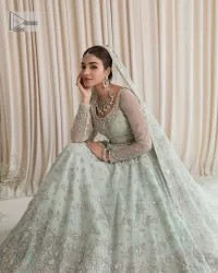 Exquisitely designed ensembles with delicate embroideries & traditional embellishments for nikah outfit statements. This beautiful maxi that comes in aqua blue colour is beautifully embellished with crystals and zardozi work. Beads, motifs,tilla, dabka, sequins, and shimmering adornments enhance the overall charm of this alluring maxi. Perfect stitching and intricate details give a royal appearance to the Bride. The bodice has a delicate and feminine V shape neckline with embellished full sleeves. Paired with lehnga and an alluring dupatta with a heavy spray of sparkling sequins and a detailed head embellished border to make your day super charming.