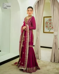 It’s bold, it’s romantic, it’s burgundy. The burgundy shade of this short shirt and gharara makes it an alluring choice for any event. Hand-crafted adornments and designs make this short shirt an epitome of beauty and royalty. The boat shape neckline o the beautiful shirt makes it a perfect choice to pair with the gharara. In addition to this, the beautiful adornments on the sleeves give a glamorous touch to this magnificent attire. It is coordinated with gharara in the same colour. The embellished borders and fine details give a perfect finish to this gharara. Finish this party wear with a dupatta framed with a four-sided border and sparkling tiny floral motifs all over to give a bold look.
