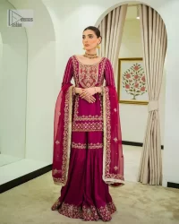 It’s bold, it’s romantic, it’s burgundy. The burgundy shade of this short shirt and gharara makes it an alluring choice for any event. Hand-crafted adornments and designs make this short shirt an epitome of beauty and royalty. The boat shape neckline o the beautiful shirt makes it a perfect choice to pair with the gharara. In addition to this, the beautiful adornments on the sleeves give a glamorous touch to this magnificent attire. It is coordinated with gharara in the same colour. The embellished borders and fine details give a perfect finish to this gharara. Finish this party wear with a dupatta framed with a four-sided border and sparkling tiny floral motifs all over to give a bold look.