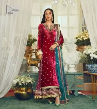 Dreamy details that scream crimson. The day outfits you need to shine your light. DeemasFashion presents this party wear which includes a long shirt, sharara and dupatta. The deep crimson shirt gives that air of regality with its stunning work with hints of tilla, dabka, kora, and Kundan scattered with champagne-mixed stones to balance the tones. The following long silhouette velvet shirt features zari and zardozi embroidery details on the embellished neckline. Further, the full sleeves are also decorated with floral motifs. It is systemized with sharara in the same colour to balance the royal look. Finish this article with a dupatta in green colour which is adorned with tiny floral motifs all over to brighten the day.