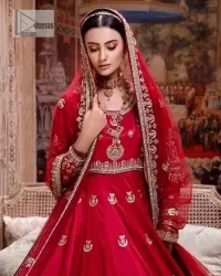 The traditional style is the new thing in the market. The stunning pishwas in the deep red shade is an eye-catching attire that gives you your desired dreamy appearance on your Big day. Beautiful work of zardozi, tilla, dabka, kora, Kundan, pearls, and beads make this attire an epitome of glamour and royalty. Embellished borders, as well as the bodice, gives an enchanting touch to this pishwas. Further, the round neckline of the outfit gives a royal touch. Further, fancy floral motifs are also adorned on the sleeves of this reception wear. It is organized with a dupatta framed with a four-sided border and sparkling tiny floral motifs all over.