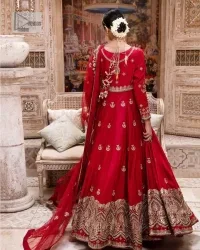 The traditional style is the new thing in the market. The stunning pishwas in the deep red shade is an eye-catching attire that gives you your desired dreamy appearance on your Big day. Beautiful work of zardozi, tilla, dabka, kora, Kundan, pearls, and beads make this attire an epitome of glamour and royalty. Embellished borders, as well as the bodice, gives an enchanting touch to this pishwas. Further, the round neckline of the outfit gives a royal touch. Further, fancy floral motifs are also adorned on the sleeves of this reception wear. It is organized with a dupatta framed with a four-sided border and sparkling tiny floral motifs all over.