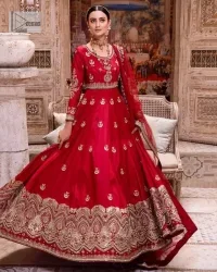 The traditional style is the new thing in the market. The stunning pishwas in the deep red shade is an eye-catching attire that gives you your desired dreamy appearance on your Big day. Beautiful work of zardozi, tilla, dabka, kora, Kundan, pearls, and beads make this attire an epitome of glamour and royalty. Embellished borders, as well as the bodice, gives an enchanting touch to this pishwas. Further, the round neckline of the outfit gives a royal touch. Further, fancy floral motifs are also adorned on the sleeves of this reception wear. It is organized with a dupatta framed with a four-sided border and sparkling tiny floral motifs all over.