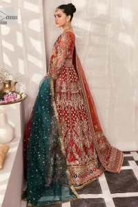 This deep rust outfit with a floral pattern has you covered for your big day. This deep rust angrakha is hand rendered in shades of multiple colours. The angrakha is decorated with gota, nakshi, dabka, and tilla in contrasting colours and is attached to hand-embellished panels. Further, the V shape neckline makes this masterpiece unique and priceless. The full sleeves of the following angrakha are a delightful way to add beauty to this mehndi wear. It is paired with a lehenga in the same colour having embroidered borders. Complete this traditional outfit with a dupatta in the green colour which is adorned with a four-sided Kiran and sequins sprayed all over.