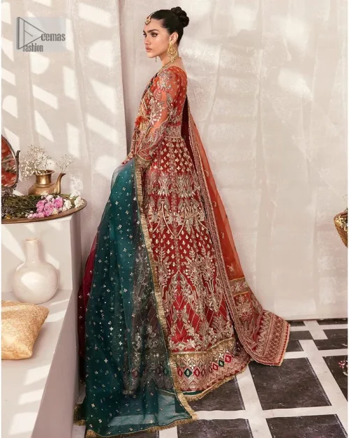 This deep rust outfit with a floral pattern has you covered for your big day. This deep rust angrakha is