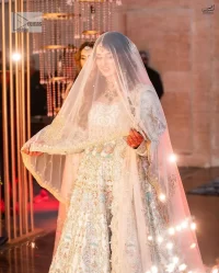 Brighten up your big day with this beautiful ensemble - Perfectly suited to the trend! DeemasFashion presents this nikah wear in the shade of ice blue. This stunning maxi has a fully embellished square neckline and full sleeves. Graceful multiple-colour work and floral designs enhance the charm of this maxi. Zardozi, pearls, dabka, kora, Kundan, and stones give a perfect finish to the overall look. The flares of the following maxi make it your foremost priority to wear on the most important day of your life. Paired this with a dupatta which is adorned with a four sided embellished borders and sequins sprayed all over to make this look more charming and perfect.