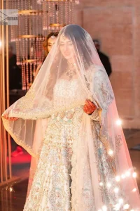 Brighten up your big day with this beautiful ensemble - Perfectly suited to the trend! DeemasFashion presents this nikah wear in the shade of ice blue. This stunning maxi has a fully embellished square neckline and full sleeves. Graceful multiple-colour work and floral designs enhance the charm of this maxi. Zardozi, pearls, dabka, kora, Kundan, and stones give a perfect finish to the overall look. The flares of the following maxi make it your foremost priority to wear on the most important day of your life. Paired this with a dupatta which is adorned with a four sided embellished borders and sequins sprayed all over to make this look more charming and perfect.