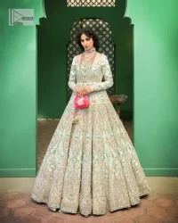 Brighten up your big day with this beautiful ensemble - Perfectly suited to the trend! DeemasFashion presents this nikah wear in the shade of ice blue. This stunning maxi has a fully embellished square neckline and full sleeves. Graceful multiple-colour work and floral designs enhance the charm of this maxi. Zardozi, pearls, dabka, kora, Kundan, and stones give a perfect finish to the overall look. The flares of the following maxi make it your foremost priority to wear on the most important day of your life. Paired this with a dupatta which is adorned with a four sided embellished borders and sequins sprayed all over to make this look more charming and perfect.