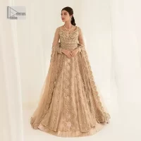 Presenting elegance personified glamorous formal nikah outfit. A heavenly-designed light golden maxi on an organza base serves as a canvas for spellbinding embellishments of antique gold, tilla, dabka, kora, Kundan and sequins. The sweetheart neckline makes this outfit unique and priceless. Furthermore, the following flawed maxi has three-quarter sleeves. It is paired with a plain lehenga and a dupatta in the same colour. The dupatta is adorned with carefully placed sequin spray and embellished four-sided borders for more calm and charm.