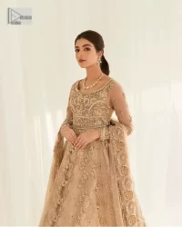 Presenting elegance personified glamorous formal nikah outfit. A heavenly-designed light golden maxi on an organza base serves as a canvas for spellbinding embellishments of antique gold, tilla, dabka, kora, Kundan and sequins. The sweetheart neckline makes this outfit unique and priceless. Furthermore, the following flawed maxi has three-quarter sleeves. It is paired with a plain lehenga and a dupatta in the same colour. The dupatta is adorned with carefully placed sequin spray and embellished four-sided borders for more calm and charm.