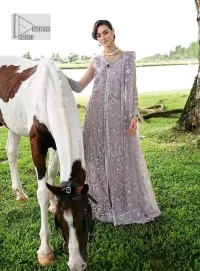 Lilac article on your Big day is like a pro. This lilac front open gown in the lilac shade is the epitome of royalty and grace. The gorgeous gown is adorned with silver dabka, pearls,tilla, kora, Kundan, zardozi and the real magic of beads. It is prominent with silver embroidery. The following gown has a V shape neckline to make this outfit remarkable. Further, the beautiful embroidery is adorned on full sleeves. The fully embellished lilac Gown will look perfect when paired with a set of plain lehenga choli. It is organized with a dupatta framed with four-sided borders and tiny floral motifs all over to gain pro magic.