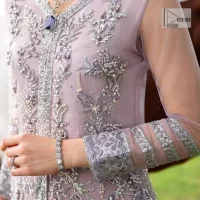 Lilac article on your Big day is like a pro. This lilac front open gown in the lilac shade is the epitome of royalty and grace. The gorgeous gown is adorned with silver dabka, pearls,tilla, kora, Kundan, zardozi and the real magic of beads. It is prominent with silver embroidery. The following gown has a V shape neckline to make this outfit remarkable. Further, the beautiful embroidery is adorned on full sleeves. The fully embellished lilac Gown will look perfect when paired with a set of plain lehenga choli. It is organized with a dupatta framed with four-sided borders and tiny floral motifs all over to gain pro magic.