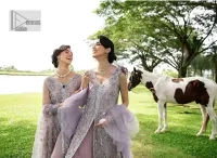 Lilac article on your Big day is like a pro. This lilac front open gown in the lilac shade is the epitome of royalty and grace. The gorgeous gown is adorned with silver dabka, pearls,tilla, kora, Kundan, zardozi and the real magic of beads. It is prominent with silver embroidery. The following gown has a V shape neckline to make this outfit remarkable. Further, the beautiful embroidery is adorned on full sleeves. The fully embellished lilac Gown will look perfect when paired with a set of plain lehenga choli. It is organized with a dupatta framed with four-sided borders and tiny floral motifs all over to gain pro magic.