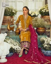 This mustard ensemble features zari and tilla details creating the perfect magical look for the season! The stunning long shirt in an alluring mustard shade comes in velvet fabric. The V-neckline of this shirt is emblazoned with embroidery and hand-crafted embellishments. Motifs, tilla, and threads give a perfect finishing look to the shirt. It is enhanced with multiple colours embroidered patches at the bottom to stole everyone's heart. It is paired with scalloped burgundy trousers to balance the overall look of this party wear. Complete this with a dupatta having tiny floral motifs and sequins sprayed all over.