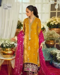 This mustard ensemble features zari and tilla details creating the perfect magical look for the season! The stunning long shirt in an alluring mustard shade comes in velvet fabric. The V-neckline of this shirt is emblazoned with embroidery and hand-crafted embellishments. Motifs, tilla, and threads give a perfect finishing look to the shirt. It is enhanced with multiple colours embroidered patches at the bottom to stole everyone's heart. It is paired with scalloped burgundy trousers to balance the overall look of this party wear. Complete this with a dupatta having tiny floral motifs and sequins sprayed all over.