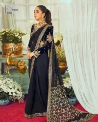 Black, is a reminder to love yourself. The navy blue blouse is augmented with elusive dabka and remarkable naqshi to highlight the grace and is further enhanced with tilla, dabka, koran and Kundan.  The V shape neckline of the following blouse is beautifully decorated with multiple colour embroidery. In addition to this, the heavy floral motifs also adorned the full sleeves to add more charm and beauty to this party wear. It is paired with a black saree to style you according to your choice. Complex work on the borders and the pallu makes it look even more gorgeous. This is a beautiful piece for a bridesmaid who has traditional taste.