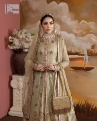 It's where words are not necessary – the outfit does all the talking! A beautiful designed pale green long shirt on an organza base has intricate details of gold, sequin, tilla, dabka, kora and tilla. A contrasting golden embroidery on the round neckline and on full sleeves is the star of the show. Each floral motif is so special, well-researched and strategically put together to create this spellbinding magic using the most gorgeous colour palette. It is paired with brocade lehenga to balance the whole outfit in a golden colour. Last but not least, the mehndi wear has a dupatta which is adorned with a four-sided embellished border in the most stunning way.