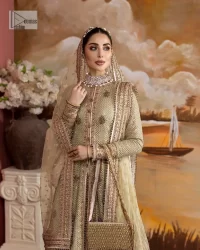 It's where words are not necessary – the outfit does all the talking! A beautiful designed pale green long shirt on an organza base has intricate details of gold, sequin, tilla, dabka, kora and tilla. A contrasting golden embroidery on the round neckline and on full sleeves is the star of the show. Each floral motif is so special, well-researched and strategically put together to create this spellbinding magic using the most gorgeous colour palette. It is paired with brocade lehenga to balance the whole outfit in a golden colour. Last but not least, the mehndi wear has a dupatta which is adorned with a four-sided embellished border in the most stunning way.