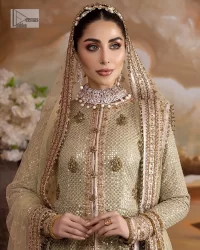 It's where words are not necessary – the outfit does all the talking! A beautiful designed pale green long shirt on an organza base has intricate details of gold, sequin, tilla, dabka, kora and tilla. A contrasting golden embroidery on the round neckline and on full sleeves is the star of the show. Each floral motif is so special, well-researched and strategically put together to create this spellbinding magic using the most gorgeous colour palette. It is paired with brocade lehenga to balance the whole outfit in a golden colour. Last but not least, the mehndi wear has a dupatta which is adorned with a four-sided embellished border in the most stunning way.