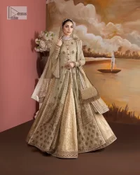 It's where words are not necessary – the outfit does all the talking! A beautiful designed pale green long shirt on an organza base has intricate details of gold, sequin, tilla, dabka, kora and tilla. A contrasting golden embroidery on the round neckline and on full sleeves is the star of the show. Each floral motif is so special, well-researched and strategically put together to create this spellbinding magic using the most gorgeous colour palette. It is paired with brocade lehenga to balance the whole outfit in a golden colour. Last but not least, the mehndi wear has a dupatta which is adorned with a four-sided embellished border in the most stunning way.